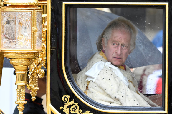 King Charles and Queen Camilla wait in the Diamond Jubilee State Coach outside Westminster Abbey.