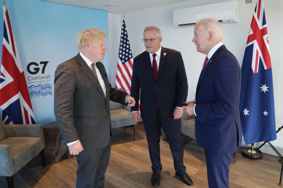 British Prime Minister Boris Johnson, Australia’s Prime Minister Scott Morrison and US President Joe Biden meet at the G7 gathering in Cornwall on Saturday. 