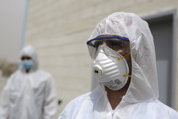 Medical staff members set up a coronavirus quarantine ward at a hospital in Sanaa, Yemen.