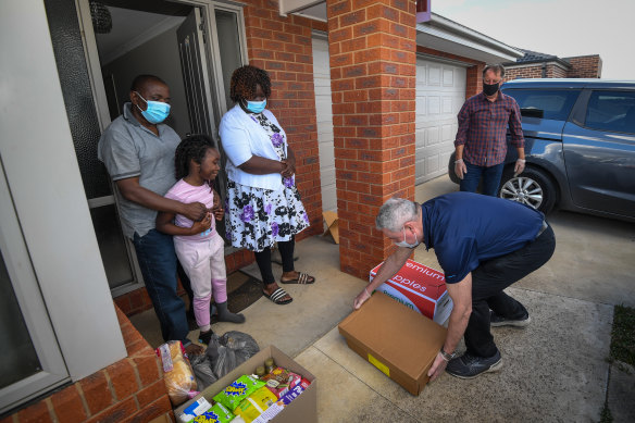 The Tshaka family receive a delivery of fresh fruit and vegetables on Friday. 