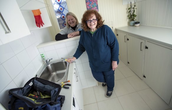 Sue Irving, front, can now change a tap washer after doing a DIY course founded by Mandy Gosetti, rear.