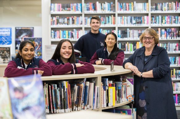 Keilor Downs College principal Linda Maxwell with some of her students, who thrived despite COVID disruptions. 