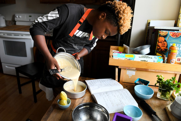 Michael Platt makes a lemon cake at his home in Bowie, Maryland. The 13-year-old started Michaels Desserts and gives away one cupcake to the homeless for every one he sells.