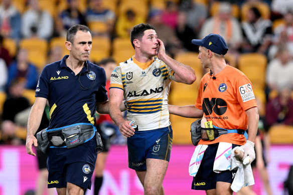 Mitch Moses makes an early exit from the Suncorp pitch.