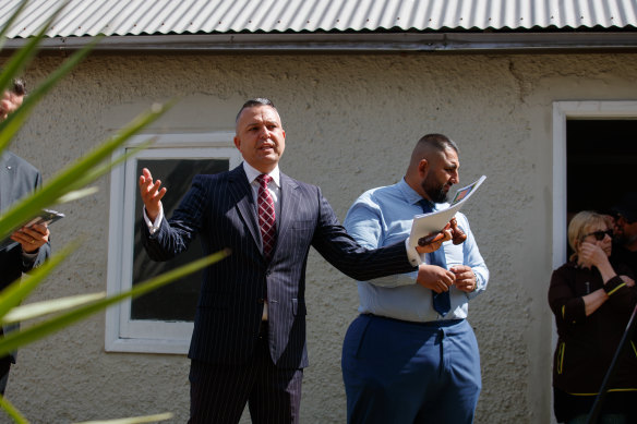 Menck White auctioneer Clarence White calls for bids during the Rosebery auction.