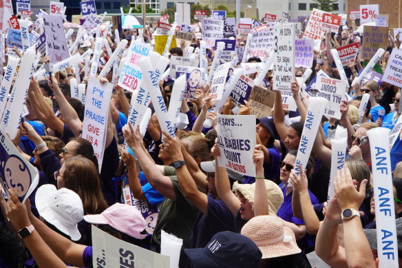 Nurses and midwvies at the rally outside Parliament House.