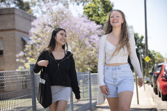 Year 12 students Andrhea Alabe and Clare Wilkes leave St Marys Senior High School for the last time after their final HSC exam on Wednesday.