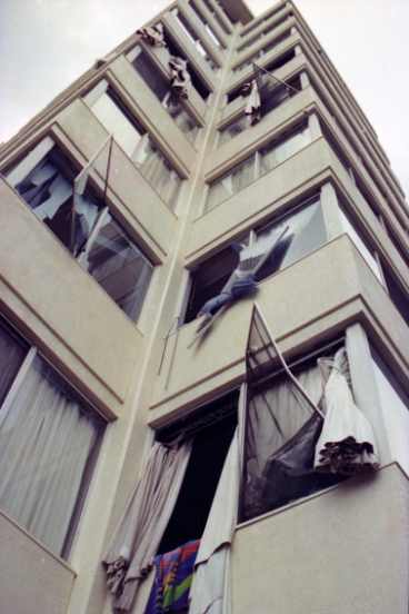 The windows in some buildings were blown out by the wind.