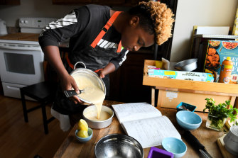 Michael Platt makes a lemon cake at his home in Bowie, Maryland. The 13-year-old started Michaels Desserts and gives away one cupcake to the homeless for every one he sells.