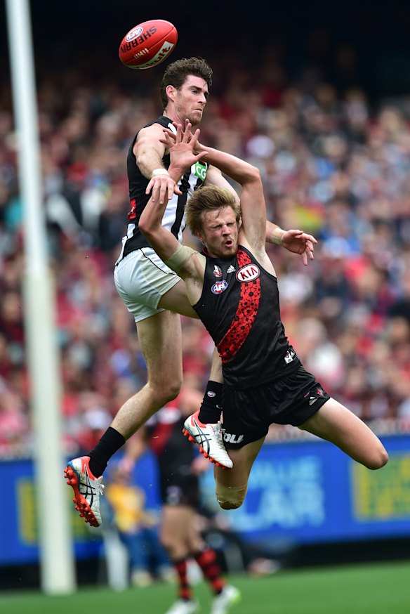 Magpies player Tyson Goldsack and the Bombers' Martin Gleeson contest.