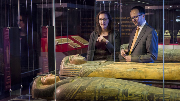 British Museum curators Dr Daniel Antoine and Dr Marie Vandenbeusch observing the Egyptian Mummies: Exploring Ancient Lives exhibition at Queensland Museum.