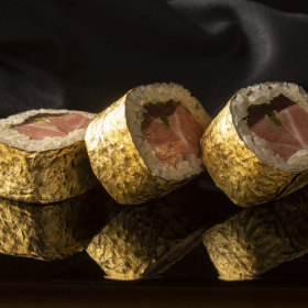 Gold-leaf wrapped maguro rolls.