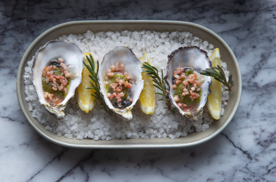 Dolly’s oysters Rockefeller adds bacon to the dish.