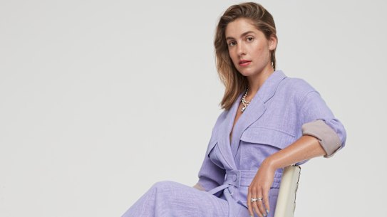 Christopher Esber  jacket, $2100, and skirt, $930.  Tiffany & Co necklace, $4350, and rings, $9400 and $2800.