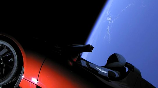 New SpaceX jumbo rocket launches Tesla into space in company milestone