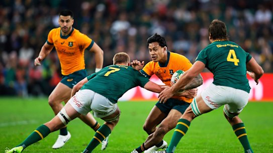 Len Ikitau charges through for the Wallabies
