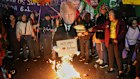 Supporters of Brazilian President Luiz Inacio Lula da Silva set fire to an effigy of US President Donald Trump during a protest on July 10.