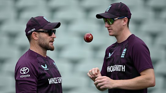 Harry Brook (right) touches base with England coach Brendon McCullum at training in Adelaide. 