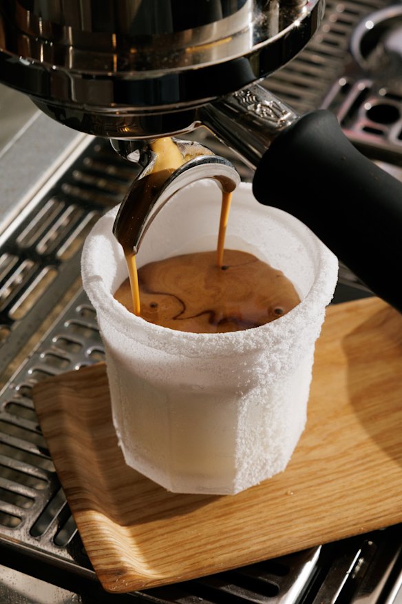 Ristretto coffee is poured over creamy milk in a frozen glass for the minus 85-degree coffee.