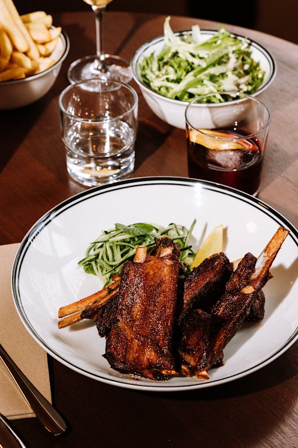 Slow-cooked Sichuan lamb ribs with cucumber and mint salad.