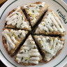 ‘Mina’ Padellino (pan-baked pizza) with white bolognese, rosemary, parmesan, finished with pecorino sauce and lemon zest.
