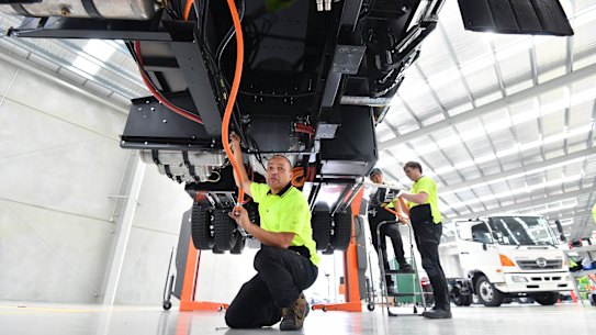 Technician Norman Bell works on an electric truck in Dandenong South. 