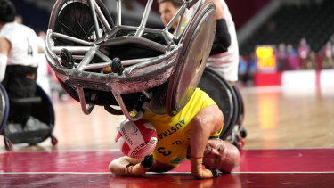 Australiaâs Ryley Batt falls during the wheelchair rugby bronze medal match against Japan. 