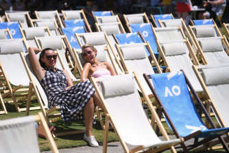 Warm sunshine and a deckchair, tennis lovers Cristina Boston (left) and Sarah Goring might as well be at the beach.