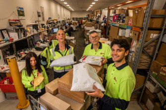 Sarah Sevian, Brian Howley,  Jim (who did not want his surname used) and Jack Gray at Australia Post’s North Melbourne delivery centre.