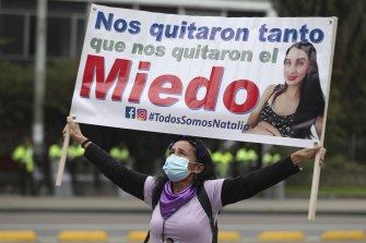 A woman holds a banner that reads in Spanish “They took so much that they even took away our fear,” during an International Women’s Day protest in Bogota in March.