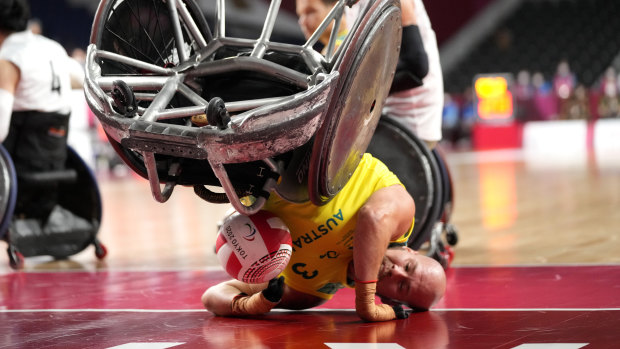 Australia’s Ryley Batt falls during the wheelchair rugby bronze medal match against Japan. 