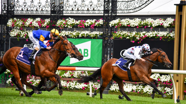 Jockey Luke Currie steers Sunlight to victory from Santa Ana Lane, ridden by Mark Zahra, in the Gilgai Stakes at Flemington on Saturday.