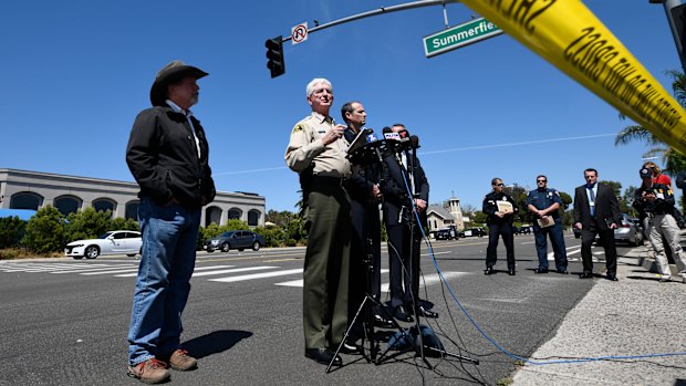 San Diego County Sheriff Bill Gore, centre, addresses the media outside  the Chabad of Poway Synagogue.