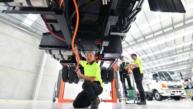 Technician Norman Bell works on an electric truck in Dandenong South. 