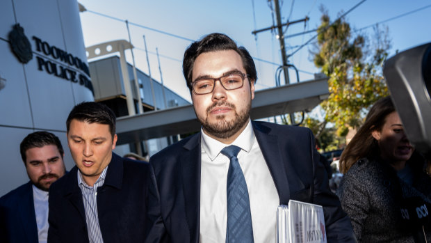 Bruce Lehrmann (right) leaves the Magistrates Court in Toowoomba last month. Lehrmann has been committed to stand trial on two counts of rape.