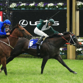 Exceedance draws away from Bivouac on the line in the Coolmore Stud Stakes.