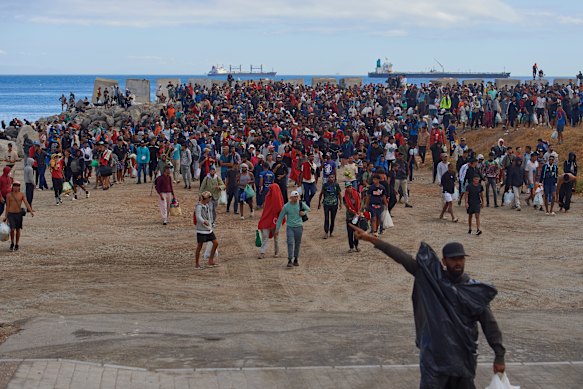 Migrants who crossed from Morocco into Spain return to a beach after being expelled from the area in the Spanish exclave of Ceuta late last month.