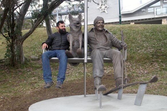 The sculpture of the late Hans Grimus and his dog Captain, installed at Mt Buller, May 2023. Pictured here is Grimus’ son Hannes.