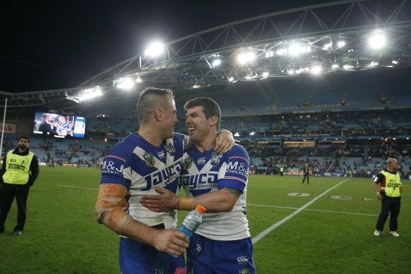 Josh Reynolds hugs Michael Ennis after what turned out to be his last game for the club, missing the 2014 grand final through injury.