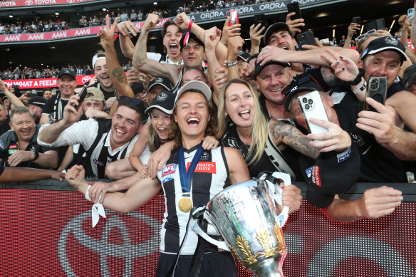 Jack Ginnivan celebrates with Magpies fans.