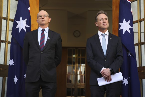 Chief Medical Officer Professor Paul Kelly and Health Minister Greg Hunt.