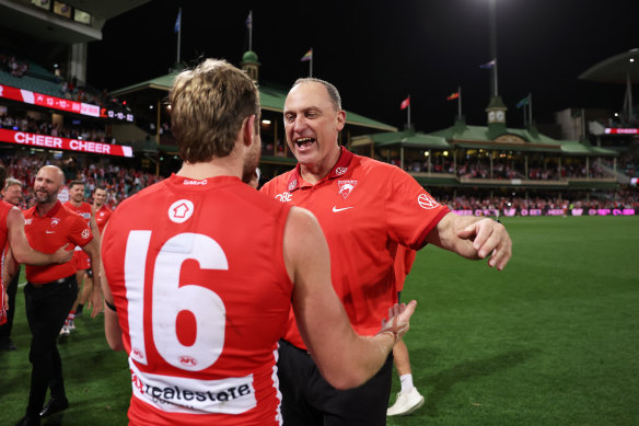 Swans coach John Longmire celebrates with Braeden Campbell.