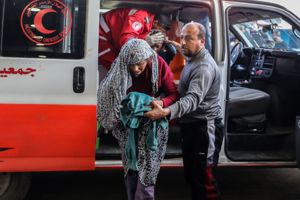 Palestinians injured in Israeli airstrikes arrive at Nasser Medical Hospital in Khan Younis in the Gaza Strip on Friday.
