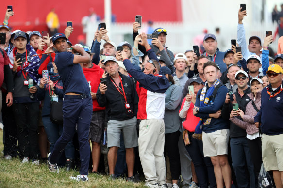 Tony Finau of team United States plays his second shot on the 18th hole.