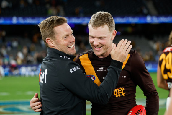 Winners are grinners: Hawthorn coach Sam Mitchell and skipper James Sicily.