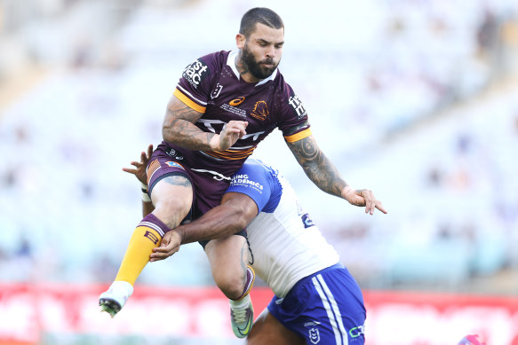 Adam Reynolds is tackled by Tevita Pangai jnr.