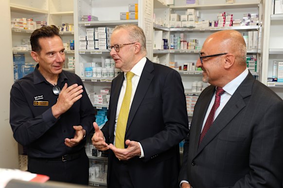 George Spyropoulos (left) chats with the PM and local MP Peter Khalil at his “pharmacino” on Thursday.
