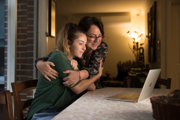 Chloe Hulme is supported by her mum Maria as she receives the results of her 2018 VCE exams.