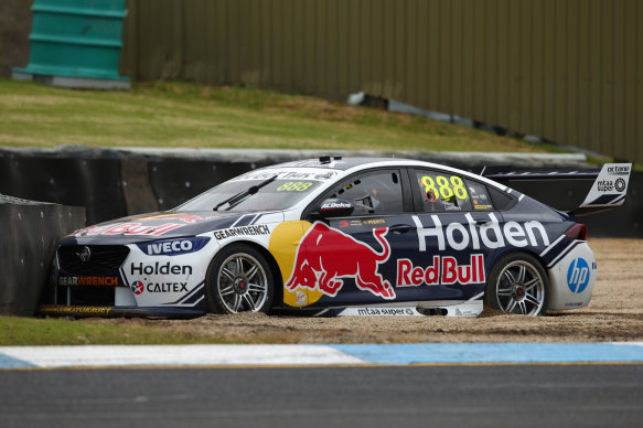 Jamie Whincup gets bogged in a sand-trap at Sandown on Friday.