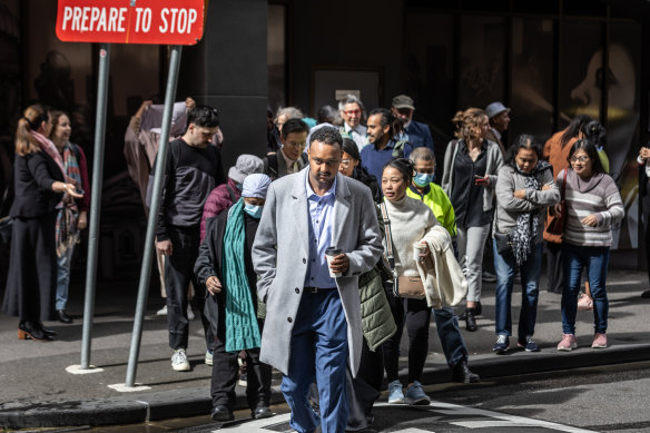Public housing tenants walk together into the Supreme Court in Melbourne in October.